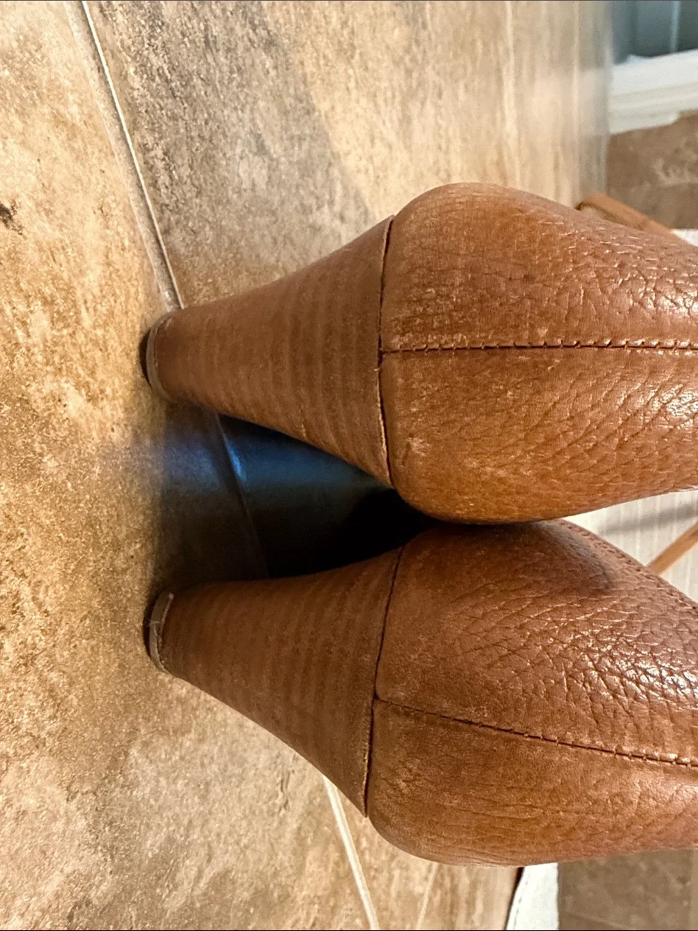 Tory Burch Cognac Leather Logo Cap-Toe Heels- worn on the front
